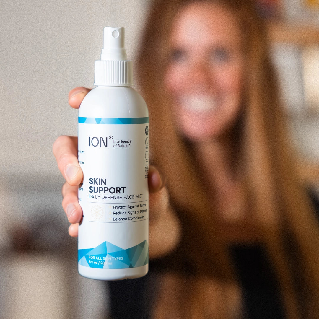 Person holding a bottle of ION Skin Support