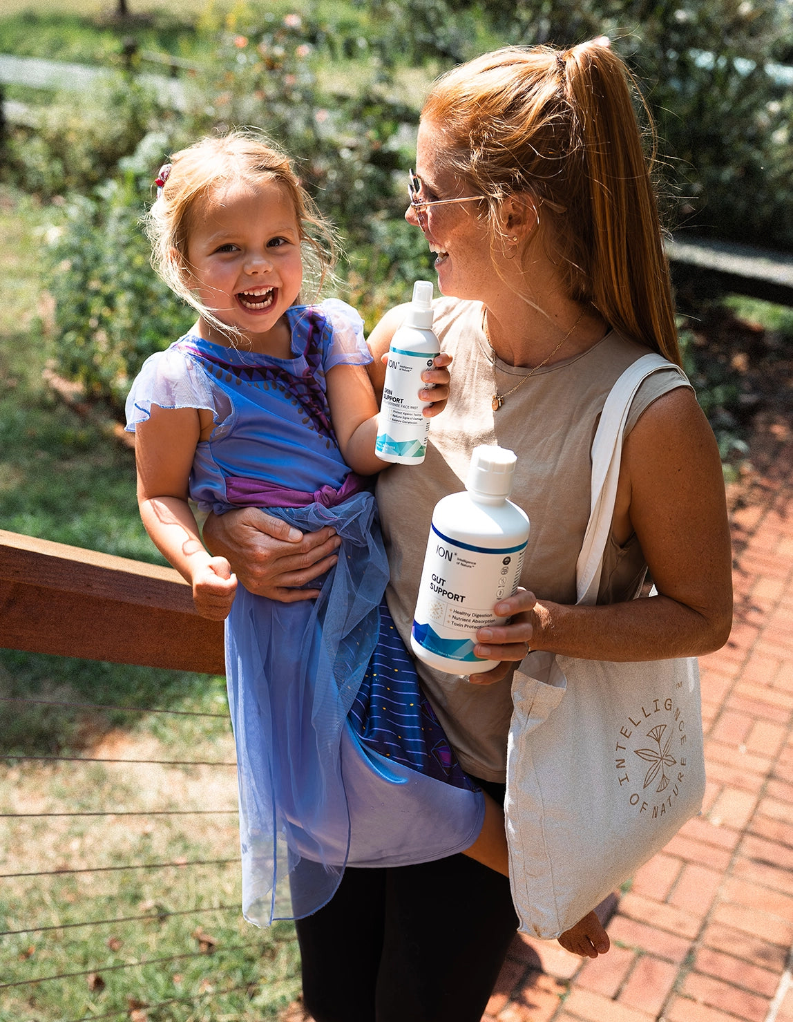 Womand holding ION product bottles