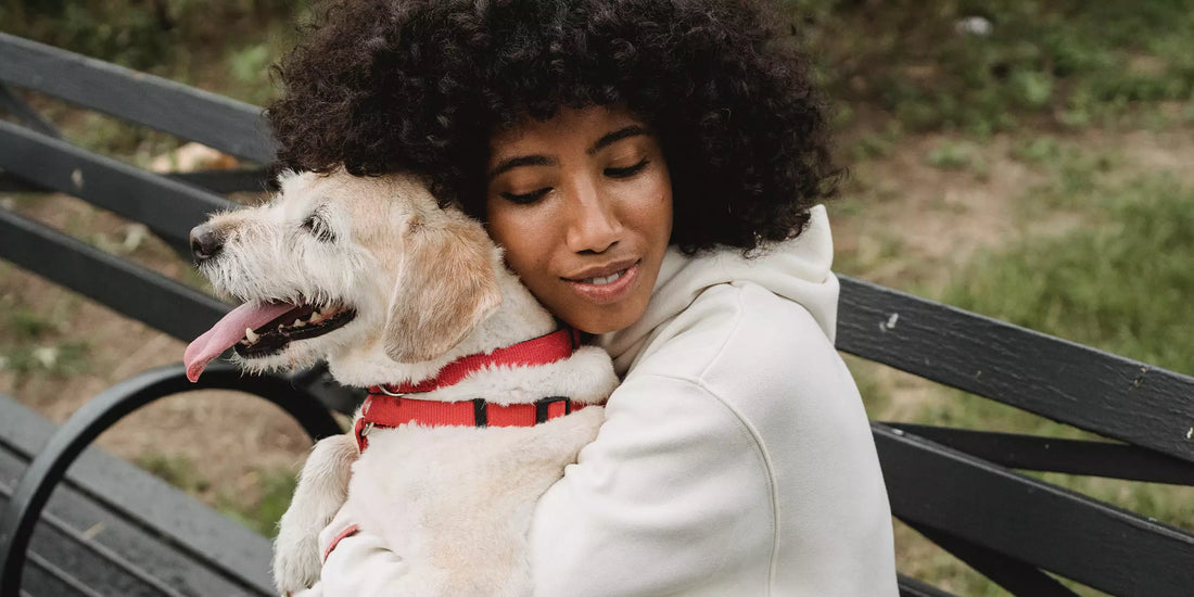 Woman hugging her dog
