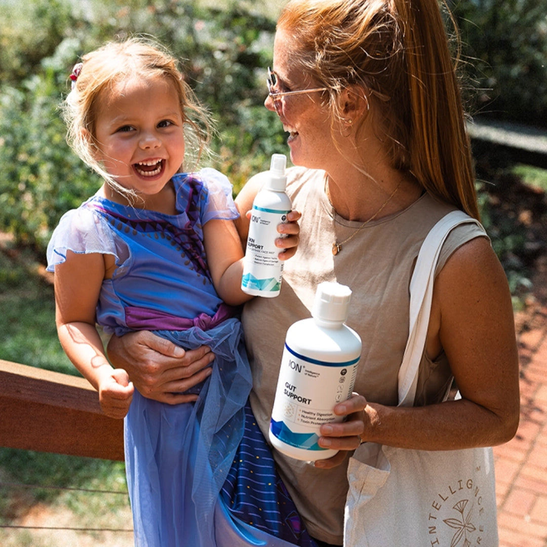 ION Skin Support and Gut Support held by woman and child