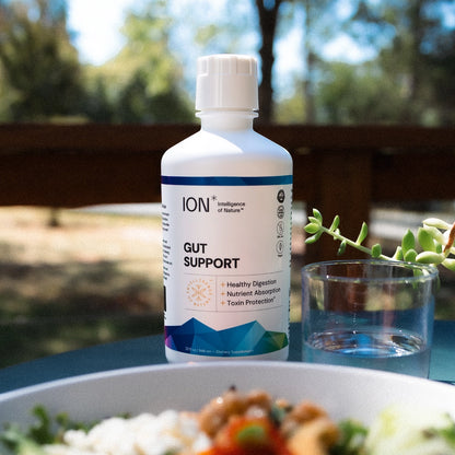 ION Gut Support supplement bottle in outdoor scene