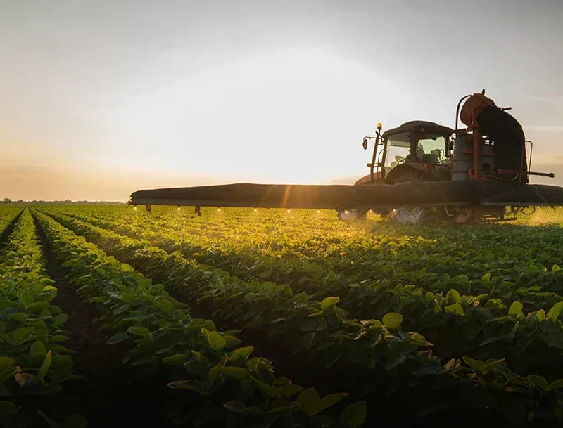 Farm equipment spraying glyphosate on crops